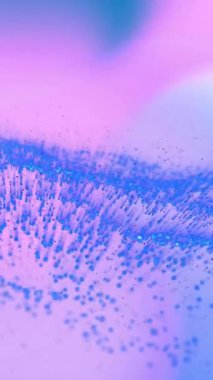 Mavi parçacıklar pembe ve mor gradyan arkaplan üzerinde dalga desenleri oluşturuyorlar, animasyon. Soyut, akışkan, dinamik, hareket, dijital, fütürist