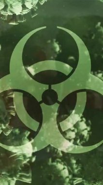 Bir grup futbolcu üzerinde yüzen virüs hücrelerinin animasyonu ve biyolojik tehlike sembolü. covid 19 pandemik konsept sırasında dijital olarak üretilen video sporu.