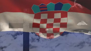 Sahnede rüzgarın açılması dalgaların birleşik bayrağı canlandırması ve bulut katmanlarını ortaya çıkarması. Vatanseverlik, sembolizm, tekstil, hareket, dinginlik, milliyetçilik, miras