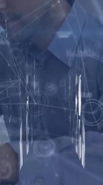 Animation of data processing over caucasian businessman working in office. Global business and digital interface concept digitally generated video.