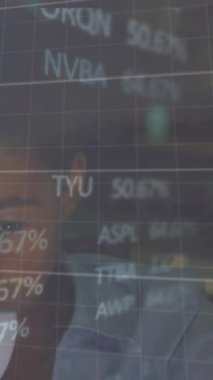Animation of financial data processing over man working in office. Global computing, finance, business and data processing concept digitally generated video.