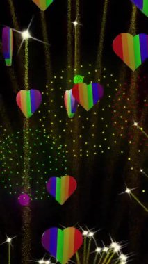 Gururlu gökkuşağı kalplerinin ve siyah arka planda patlayan havai fişeklerin animasyonu. Gurur ayı, lgbt, insan hakları ve eşitlik kavramı dijital olarak oluşturulmuş video.