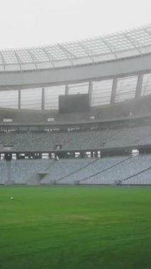 Animation of media icons over sports stadium. Global sport and digital interface concept digitally generated video.