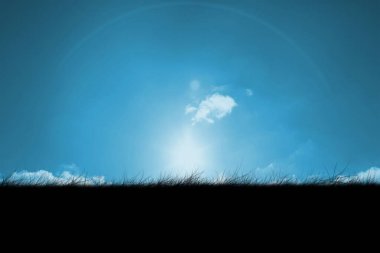Digitally generated Blue sky over grass