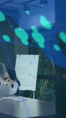 Animation of financial data processing over diverse business people. Global business, finances, computing and data processing concept digitally generated video