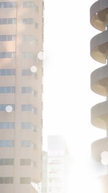 Animation of spots moving over cityscape. Global business and digital interface concept digitally generated video.