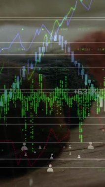 Fırçaların üzerinde finansal grafiklerin ve simgelerin canlandırılması. tarım, finans ve ekonomi konsepti dijital olarak üretilen video.