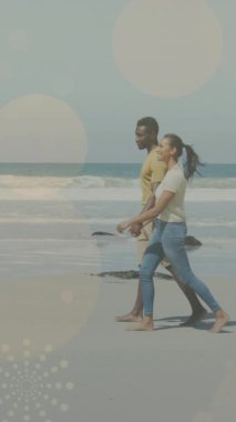 Afrika kökenli Amerikalı çiftlerin el ele tutuşmaları ve yürümeleri üzerine ışık noktalarının canlandırılması. yürüyüş günü ve dijital olarak oluşturulan video konsepti.