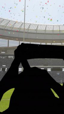 Arka planda taraftarların tezahürat yaptığı renkli konfetiler ve spor stadyumları var. Spor yarışması ve turnuva konsepti