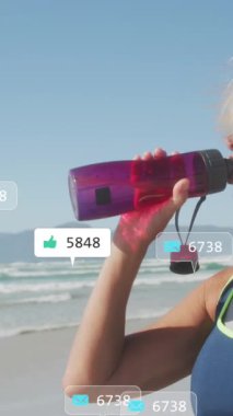 Sahildeki tatbikatlar sırasında Kafkas içkisi üzerine sosyal medya veri işleme animasyonu. Küresel fitness, ağlar, hesaplama, dijital arayüz ve dijital olarak oluşturulmuş video işleme kavramı.