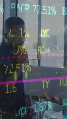 Animation of statistics and data processing over diverse business people working in office. Global business, finances, computing and data processing concept digitally generated video.