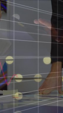 Animation of graphs, cropped hand of woman using digital tablet on diverse coworkers sharing ideas. Digital composite, multiple exposure, teamwork, report, business, teamwork, office and technology.