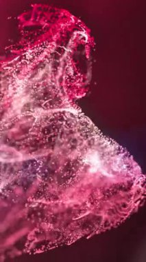 Siyah arka planda Bokeh ışıkları olan pembe ve kırmızı parçacıkların animasyonu. hareket, enerji ve renk, soyut arayüz arkaplan kavramı dijital olarak oluşturulmuş video.
