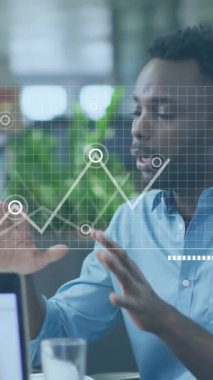 Animation of financial data processing over diverse business people in office. Global business, finances, computing and data processing concept digitally generated video.