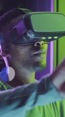 Animation of data processing, african american male it engineer in vr goggles and computer servers. Global computing and data processing concept digitally generated video