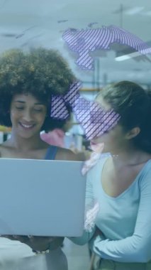 Animation of globe over diverse business people in office. Global business and digital interface concept digitally generated video.