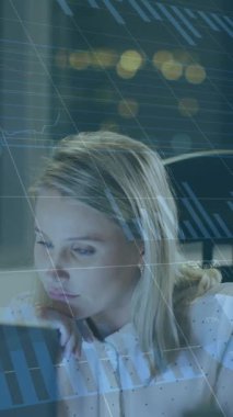 Animation of data processing over caucasian businesswoman using laptop in office. global business, computing and digital interface concept digitally generated video.