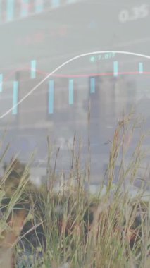 Animation of financial data processing over cityscape. Global business, finances, computing and data processing concept digitally generated video.