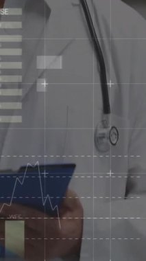 Animation of data processing over caucasian male senior doctor writing on clipboard at hospital. Medical healthcare and business data technology concept