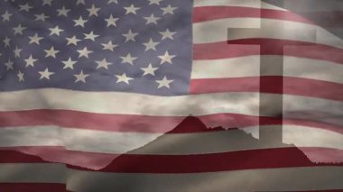 Şiddetli esinti, bayrağın bayrak dalgalanmasına neden oluyor. Arkasında çapraz silueti ortaya çıkarıyor. Vatanseverlik, açık hava, sembolik, hareket, kumaş, manzara, ruhsal