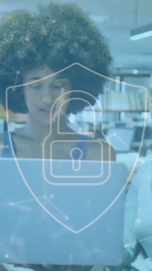 Animation of online security padlock and data processing over diverse business people in office. Global business, finance, computing and data processing concept digitally generated video.