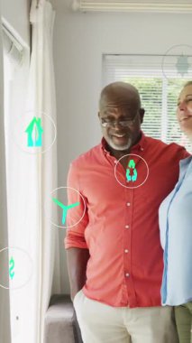 Kıdemli çiftler üzerinde simgelerin canlandırılması. Küresel yaşam tarzı, hesaplama ve dijital arayüz konsepti dijital olarak oluşturulmuş video.