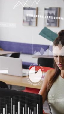 Animation of financial data processing over diverse business people in office. Global business, finances, computing and data processing concept digitally generated video.