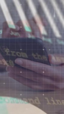 Animation of statistics and financial data processing over caucasian man using smartphone. Global business, connections, networks and data processing concept digitally generated video.