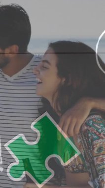 Renkli yapboz parçalarının animasyonu ve okul ikonları yaz plaj partisinde mutlu arkadaşlara karşı. otizm, öğrenme güçlüğü, destek ve farkındalık kavramı dijital olarak oluşturulmuş video.