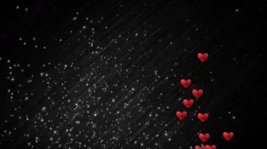 Kırmızı kalp şekilleri ortaya çıkmaya başlar ve arka planda yükselir. Aşk akışını görselleştirir. Romantizm, şefkat, hareket, dijital sanat, kutlama, birlik, coşku