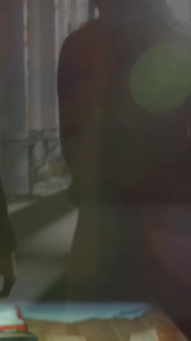 Animation of caucasian man with smartphone and coffee over businesspeople at airport. Business, working in office and technology concept digitally generated video.