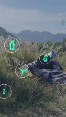 Yenilenebilir enerji ve sürdürülebilirlik, doğada dinlenen insan üzerinde canlandırma simgeleri oluşturur. sürdürülebilir, ekoloji, çevre, yeşil, gevşeme, koruma