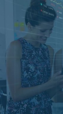 Animation of financial data processing and stock market over diverse business people. global business, finances and digital interface concept digitally generated video.