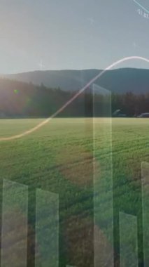 Tarımsal alan ve manzara üzerindeki finansal grafiklerin animasyonu. tarım, finans ve ekonomi konsepti dijital olarak üretilen video.