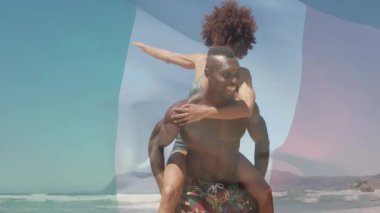 Su hattındaki bir çift, teknoloji bayrağı grafiği birleşmeyi göstermenin gerisinde kalıyor. Romantizm, şefkat, eğlence, açık hava, coşku, birliktelik, tasasız