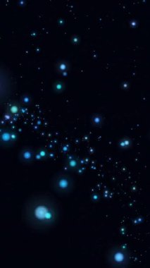 Siyah arka planda parlayan ışık lekelerinin canlandırması. Işık, renk ve hareket konsepti dijital olarak oluşturulmuş video.