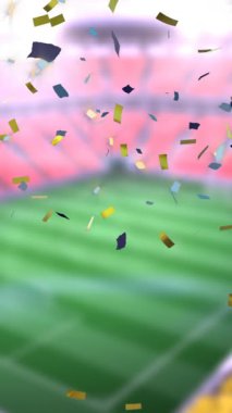 Animation of falling golden confetti over football stadium. World cup soccer concept digitally generated video.
