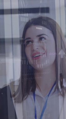 Animation of financial data processing over diverse business people in office. Global networks, computing, business, finance and data processing concept digitally generated video.