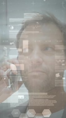 Animation of financial data processing over man using smartphone. Global business, finances, computing and data processing concept digitally generated video.