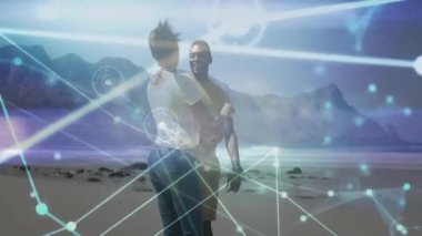 Erkek dansçı kol kaldırıyor kumsalda dönen yol gösterici partner, teknoloji titreşimli bağlantıyı örtüyor. Romantizm, bağlantı, dinginlik, fütüristik, hareket, zarafet, rahatlık