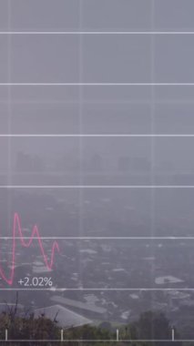 Animation of financial data processing over cityscape. Global business, finances, computing and data processing concept digitally generated video.