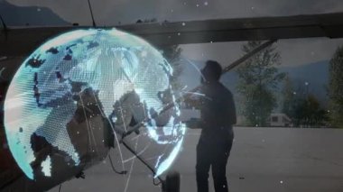 Yer gücü kablo kanat payandasını bağlayan pilot sistem kontrolü için dönen dünya hologramını çalıştırıyor. Havacılık, teknoloji, bağlantı, yenilik, dijital, uzay, fütürist