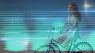 Dişi bisikletçi mavi bisikletle pedal çeviriyor turkuaz ışıkları aktive ederek dijital teknolojiyi gösteriyor. Fütürist, neon, dinamik, hareket, teknoloji, yenilik, soyut