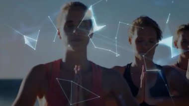 İyi odaklı kadınlar kıyıda durup dua ediyor, parlayan dijital çizgiler holografik küre oluşturuyorlar. Farkındalık, bağlantı, dinginlik, teknoloji, doğa, uyum, meditasyon