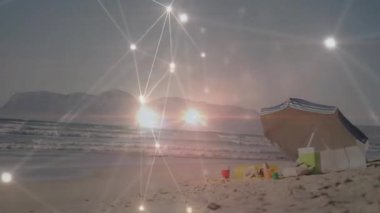 Parlak ağ, titreşen ve sürüklenen sonra da çizgili şemsiyeyi ve oyuncakları ortaya çıkarmak için soluyor. Teknoloji, bağlantı, sahil, boş zaman, açık hava, minimal, sükunet