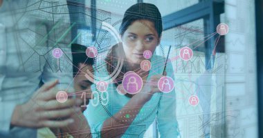 Manipulating analyst in turquoise top using stylus on display in office room with map grid overlay. Technology, collaboration, innovation, data visualization, modernism, interface, business