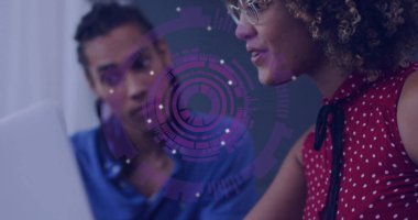 Collaborating tech team analyzing purple digital graphic at office desk with laptop and eyeglasses. Collaboration, innovation, technology, data, teamwork, digital, professional