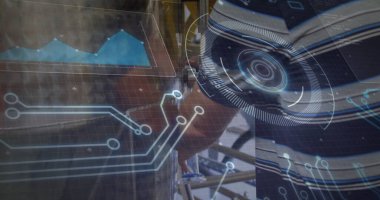 Tightening gloved builder with HUD fastening scaffolding tube clamp at renovation site, copy space. Construction, industrial, technology, engineering, urban, safety, innovation