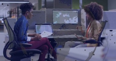 Reviewing printed reports, colleagues in office wear holding coffee cup at open-plan office desks. Collaboration, teamwork, professional, modern, workspace, communication, productivity