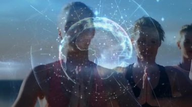 Dünya, kadınların plajda meditasyon yaparken sağlık için titreşen düğümler sonra da gözleri açıyor. Dijital, küresel, bağlantı, uyum, dinginlik, maneviyat, farkındalık